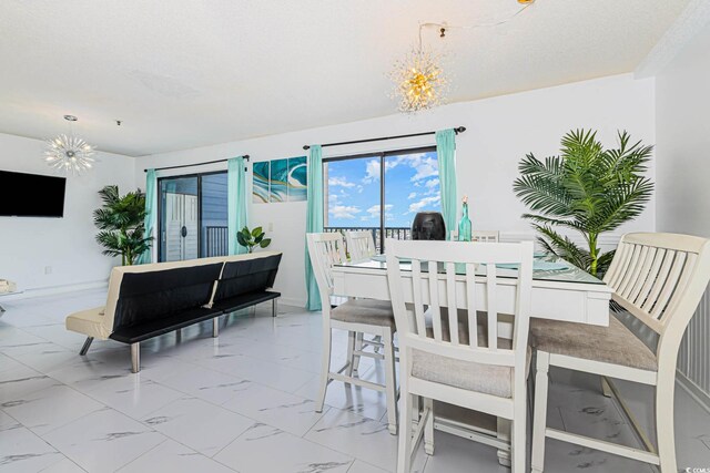 5905 S Kings Hwy Unit 344B, Myrtle Beach, SC 29575 - dining room with a chandelier and marble look tiles