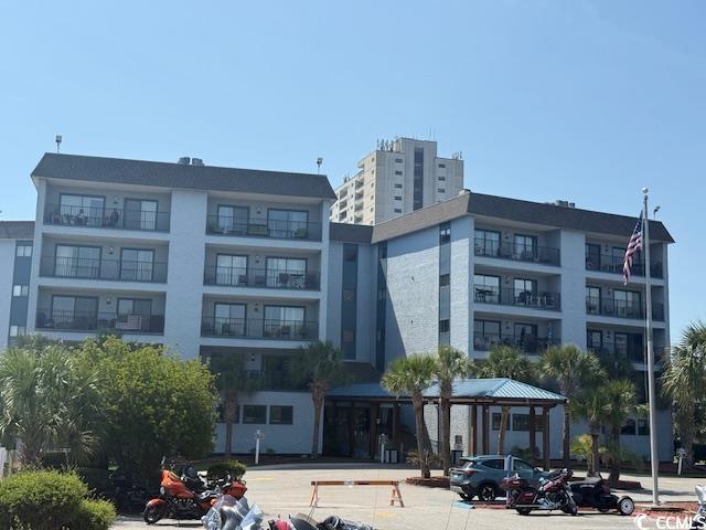 5905 S Kings Hwy Unit 344B, Myrtle Beach, SC 29575 - view of apartment building / complex featuring uncovered parking