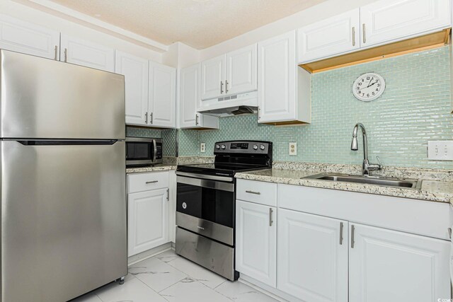 5905 S Kings Hwy Unit 344B, Myrtle Beach, SC 29575 - kitchen featuring stainless steel appliances, under cabinet range hood, a sink, light marble finish flooring, and white cabinetry