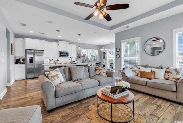 104 Splendor Cir, Murrells Inlet, SC 29576 - living area featuring wood finished floors, a ceiling fan, a chandelier, recessed lighting, and baseboards