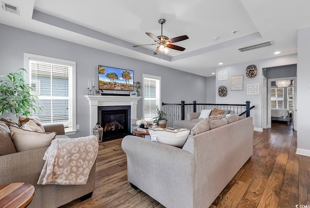 104 Splendor Cir, Murrells Inlet, SC 29576 - living room with a tray ceiling, ceiling fan, dark wood-type flooring, plenty of natural light, and recessed lighting