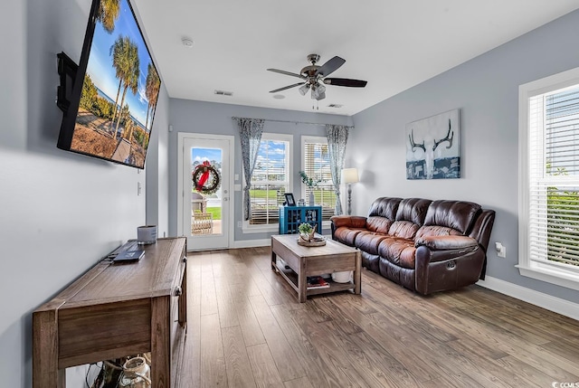 104 Splendor Cir, Murrells Inlet, SC 29576 - living area featuring wood finished floors, a ceiling fan, healthy amount of natural light, and baseboards
