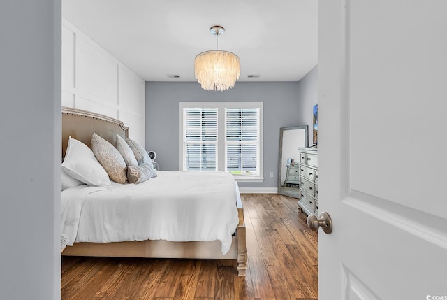 104 Splendor Cir, Murrells Inlet, SC 29576 - bedroom with wood finished floors, a chandelier, and baseboards