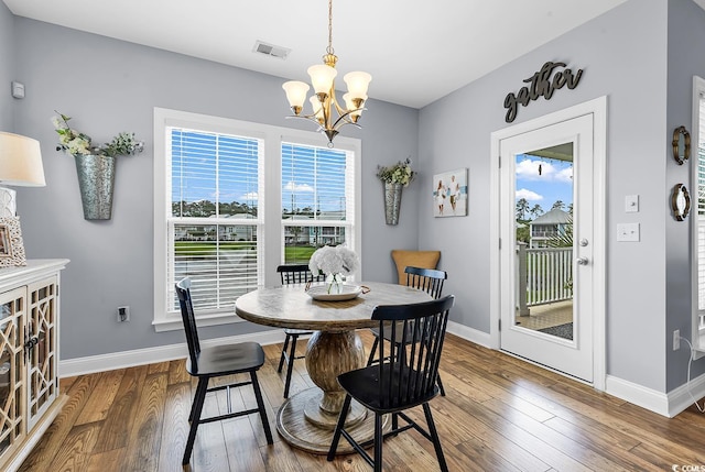104 Splendor Cir, Murrells Inlet, SC 29576 - dining room with baseboards, a chandelier, hardwood / wood-style flooring, and healthy amount of natural light