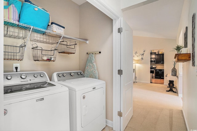 505 Joy Way Ct, Longs, SC 29568 - washroom featuring washing machine and dryer, baseboards, and light carpet