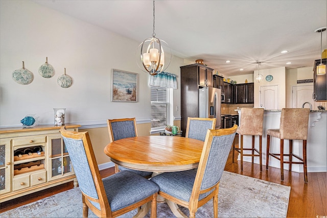 505 Joy Way Ct, Longs, SC 29568 - dining area featuring recessed lighting, a chandelier, wood finished floors, and baseboards