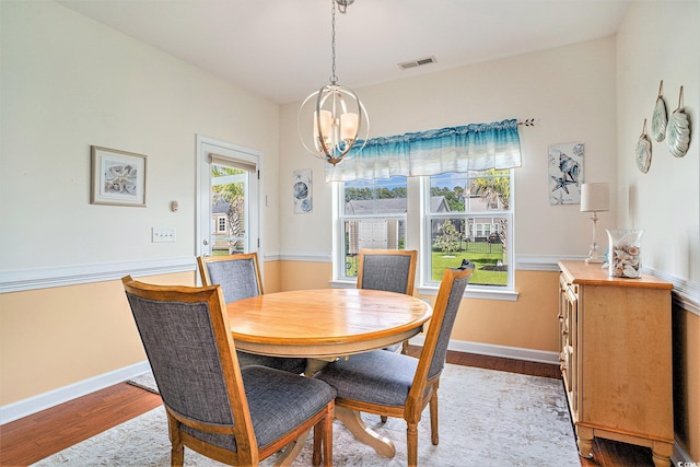 505 Joy Way Ct, Longs, SC 29568 - dining area featuring a chandelier, wood finished floors, and baseboards