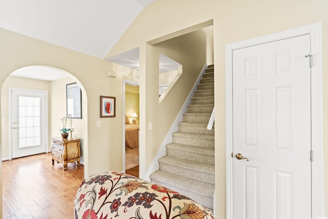 4002 Acorn Way N, Myrtle Beach, SC 29582 - staircase featuring arched walkways, wood finished floors, and vaulted ceiling