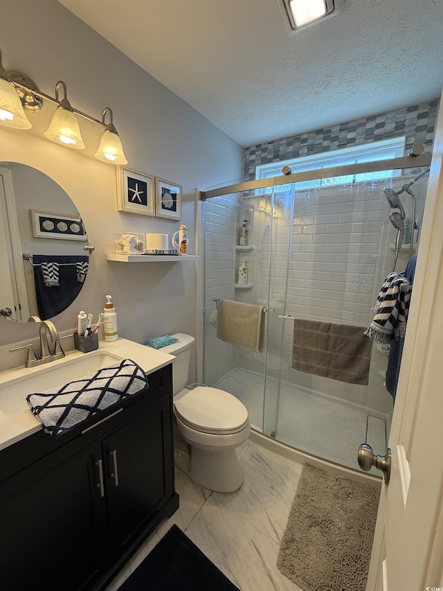 550 Bridgeport Dr, Myrtle Beach, SC 29577 - bathroom with vanity, a shower stall, toilet, marble finish flooring, and a textured ceiling