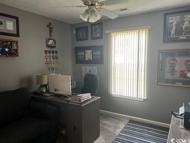 550 Bridgeport Dr, Myrtle Beach, SC 29577 - carpeted home office with ceiling fan, baseboards, and a textured ceiling