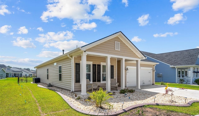 1664 White Starfish Ct, Calabash, NC 28467 - view of front of house with a porch, a garage, concrete driveway, and central air condition unit