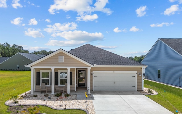 1664 White Starfish Ct, Calabash, NC 28467 - view of front of house featuring a garage, a porch, a front lawn, driveway, and roof with shingles