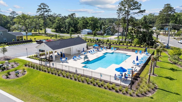 1664 White Starfish Ct, Calabash, NC 28467 - community pool with a patio area and view of wooded area