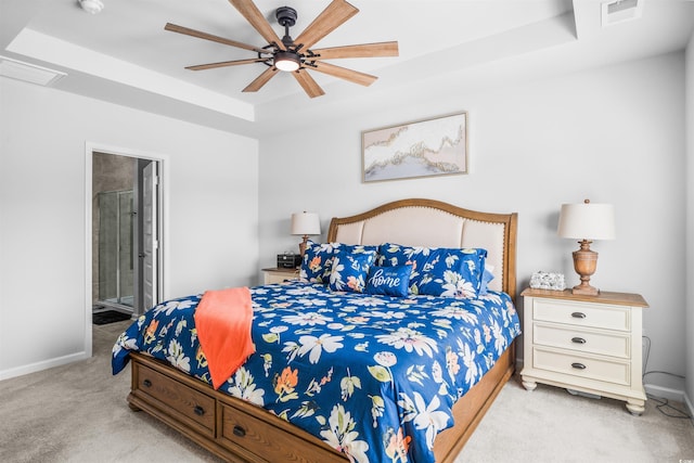 1664 White Starfish Ct, Calabash, NC 28467 - carpeted bedroom with a tray ceiling, ensuite bathroom, baseboards, and a ceiling fan