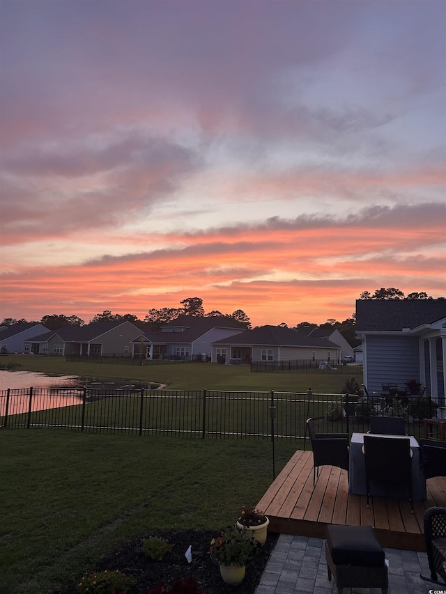 1664 White Starfish Ct, Calabash, NC 28467 - yard at dusk with a wooden deck and a residential view