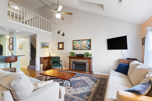 1422 Baldwin Ct Unit 1422, Little River, SC 29566 - living area featuring wood finished floors, stairs, high vaulted ceiling, ceiling fan, and baseboards