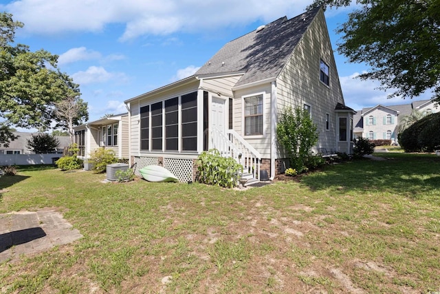 1422 Baldwin Ct Unit 1422, Little River, SC 29566 - view of home's exterior with a lawn, entry steps, and a shingled roof