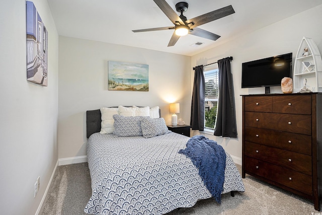 bedroom with carpet flooring, baseboards, and ceiling fan
