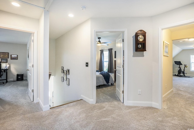 hallway with carpet, recessed lighting, and baseboards