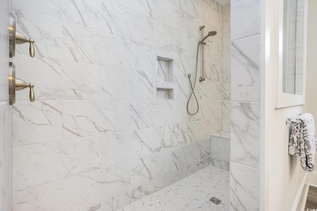 full bath featuring a tile shower