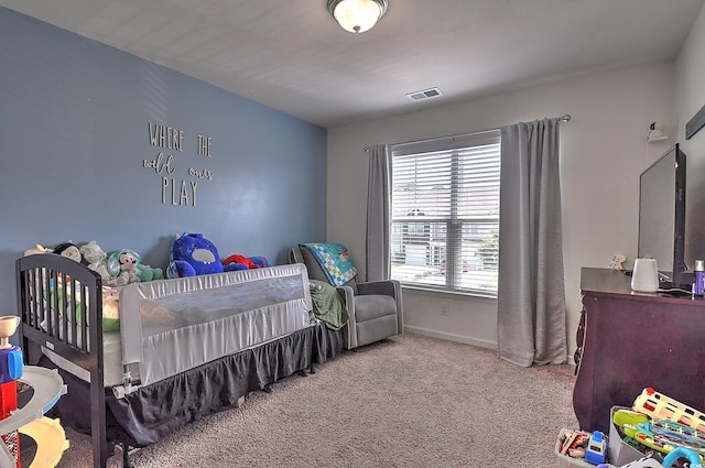 carpeted bedroom with baseboards