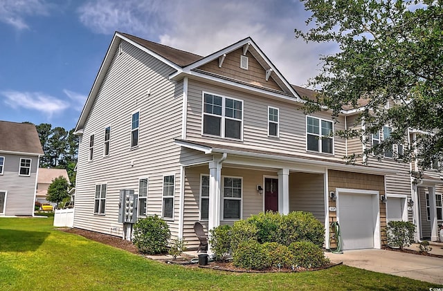 view of front of property featuring a garage, a front lawn, driveway, and covered porch