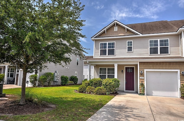 view of front of house featuring a front yard, an attached garage, driveway, and a shingled roof