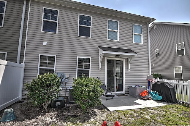 rear view of house with a patio