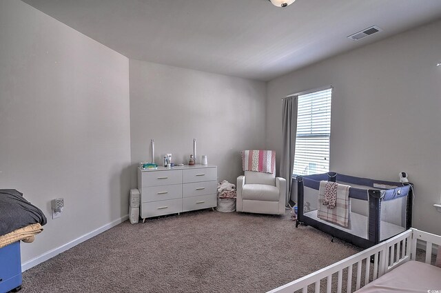 bedroom featuring carpet floors and baseboards