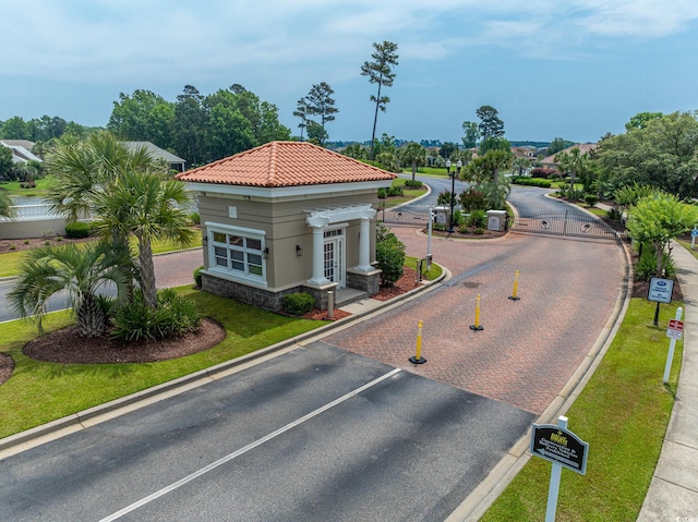 616 Edgecreek Dr, Myrtle Beach, SC 29579 - view of asphalt street featuring curbs and a gated entry
