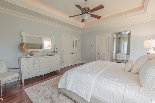 616 Edgecreek Dr, Myrtle Beach, SC 29579 - bedroom featuring a tray ceiling, dark wood-type flooring, ornamental molding, and ceiling fan