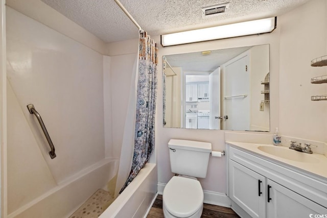 1501 Ocean Blvd S Unit 103, North Myrtle Beach, SC 29582 - full bathroom featuring vanity, a textured ceiling, shower / tub combo, and toilet