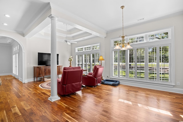 423 Chapman Loop, Pawleys Island, SC 29585 - living room with ornamental molding, wood-type flooring, beamed ceiling, arched walkways, and a ceiling fan