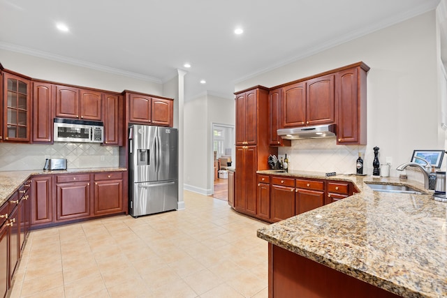 423 Chapman Loop, Pawleys Island, SC 29585 - kitchen featuring appliances with stainless steel finishes, a sink, light stone counters, tasteful backsplash, and recessed lighting