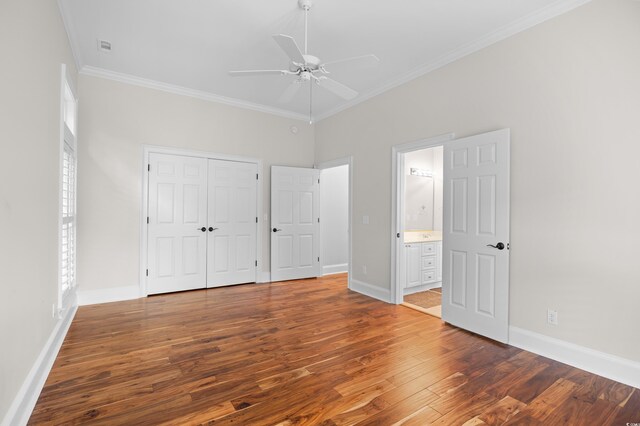 423 Chapman Loop, Pawleys Island, SC 29585 - unfurnished bedroom featuring wood finished floors, crown molding, and baseboards
