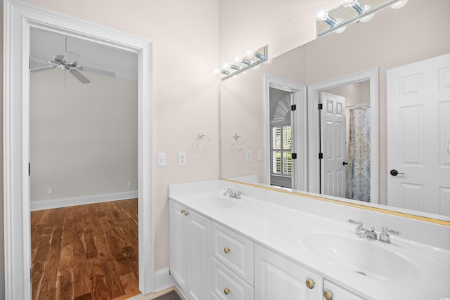 423 Chapman Loop, Pawleys Island, SC 29585 - full bathroom with wood finished floors, ceiling fan, baseboards, and double vanity