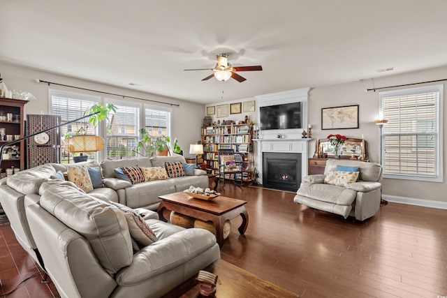 1189 Wyatt Ln, Myrtle Beach, SC 29577 - living room with ceiling fan, wood finished floors, a fireplace, and baseboards