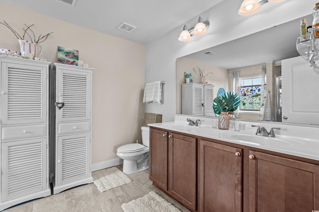 1189 Wyatt Ln, Myrtle Beach, SC 29577 - bathroom with a closet, double vanity, toilet, and baseboards