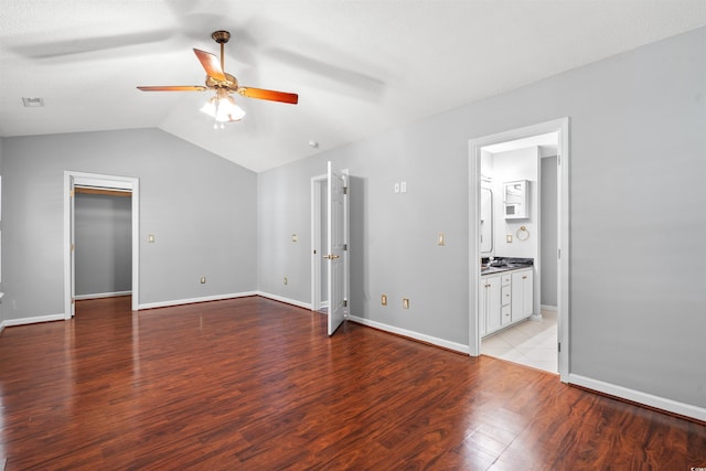 4406 Barcelona Ln, Little River, SC 29566 - unfurnished bedroom with light wood-style floors, vaulted ceiling, baseboards, and ensuite bathroom