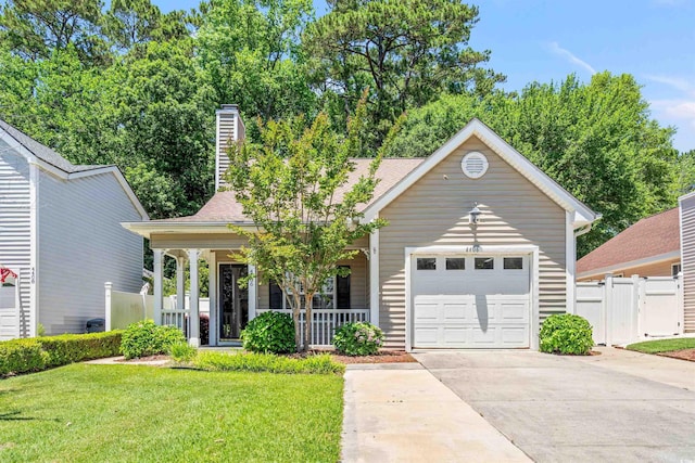 4406 Barcelona Ln, Little River, SC 29566 - view of front of house featuring covered porch, concrete driveway, a garage, a gate, and a chimney