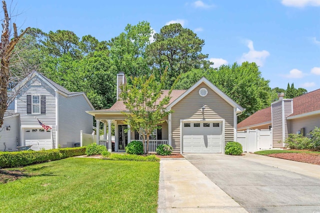 4406 Barcelona Ln, Little River, SC 29566 - view of front of house with concrete driveway, covered porch, a chimney, and an attached garage