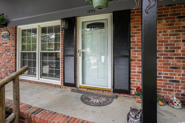1205 King St, Myrtle Beach, SC 29577 - property entrance with brick siding and covered porch
