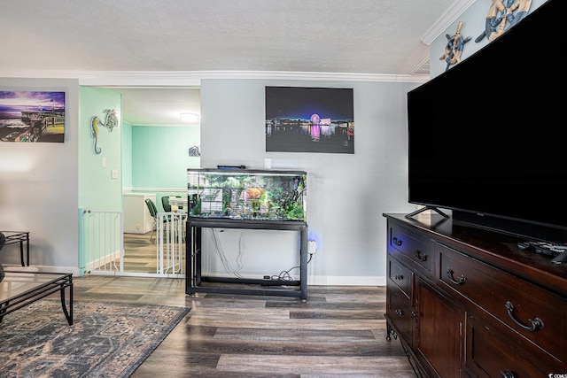 1205 King St, Myrtle Beach, SC 29577 - living area with ornamental molding, wood finished floors, baseboards, and a textured ceiling