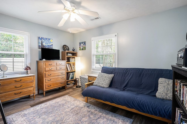 1205 King St, Myrtle Beach, SC 29577 - living area with plenty of natural light, wood finished floors, and a ceiling fan