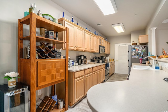 2180 Waterview Dr Unit 725, North Myrtle Beach, SC 29582 - kitchen with appliances with stainless steel finishes, a sink, wine cooler, light countertops, and light wood-type flooring