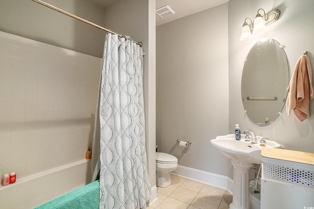 2180 Waterview Dr Unit 725, North Myrtle Beach, SC 29582 - bathroom with tile patterned flooring, toilet, baseboards, and shower / bath combo with shower curtain