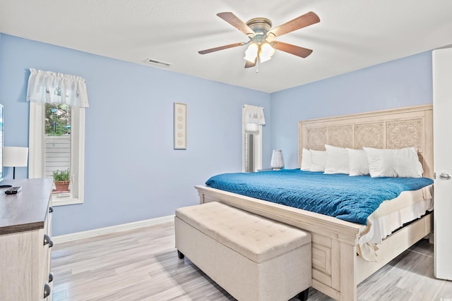 430 Ocean Creek Dr Unit 2534, Myrtle Beach, SC 29572 - bedroom with light wood-type flooring, baseboards, and ceiling fan