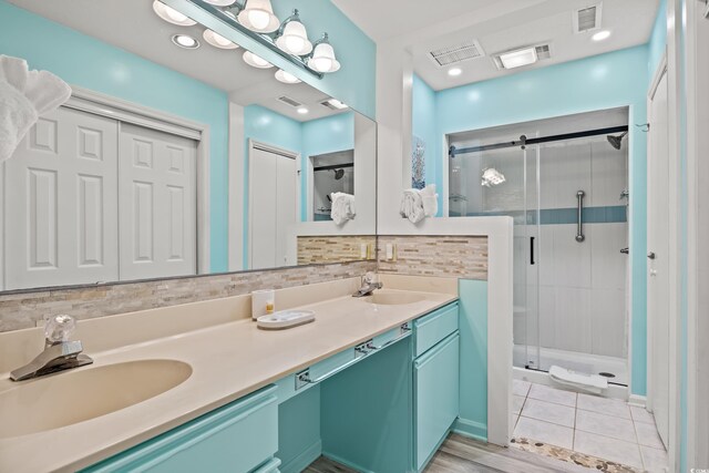 430 Ocean Creek Dr Unit 2534, Myrtle Beach, SC 29572 - bathroom featuring a stall shower, double vanity, and tile patterned flooring