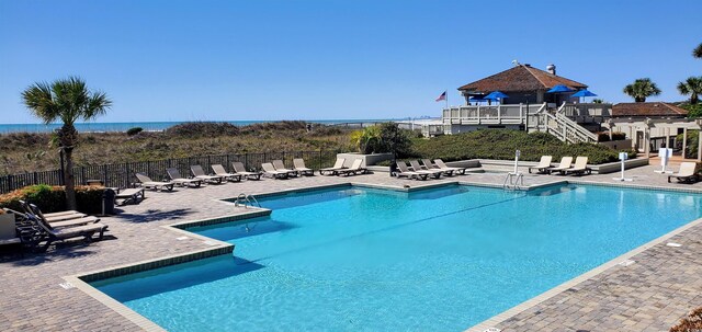 430 Ocean Creek Dr Unit 2534, Myrtle Beach, SC 29572 - community pool featuring a patio area and stairway