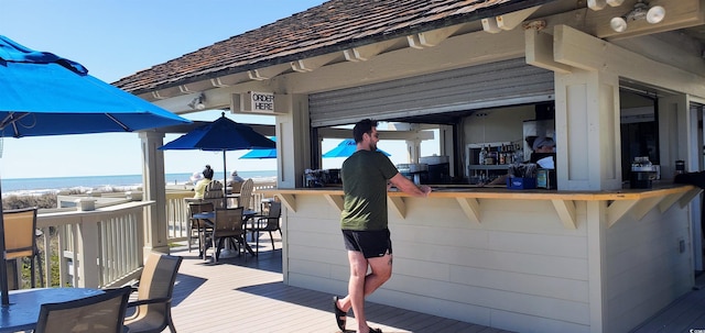 430 Ocean Creek Dr Unit 2534, Myrtle Beach, SC 29572 - wooden terrace featuring outdoor dining area and a water view